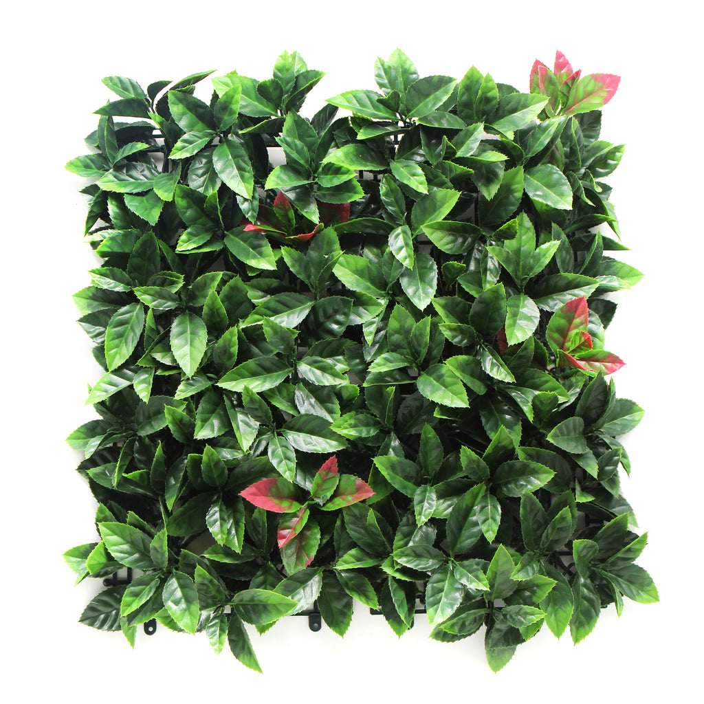 Artificial green leaf panel with a white background