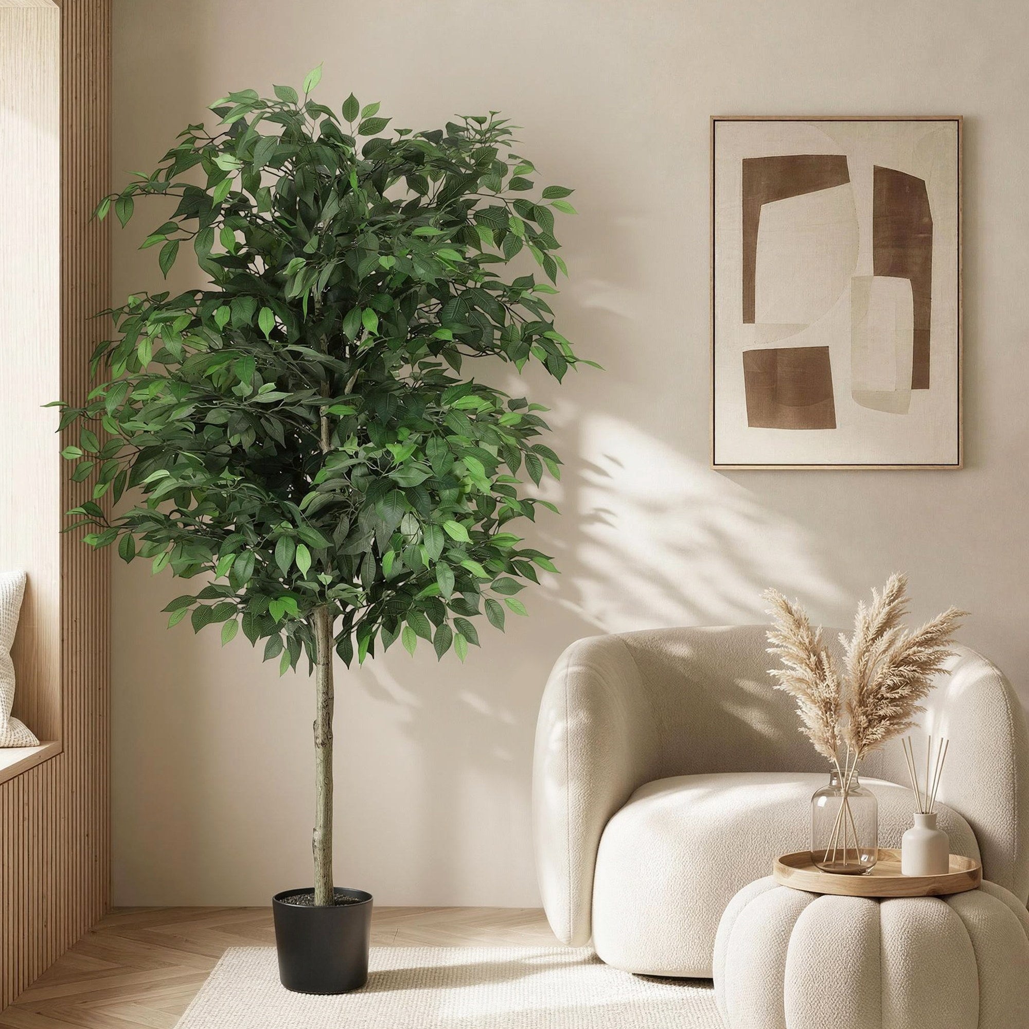 Potted plant in a living room with a modern armchair and abstract art on the wall.