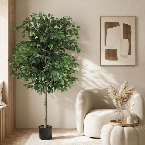 Potted plant in a living room with a modern armchair and abstract art on the wall.